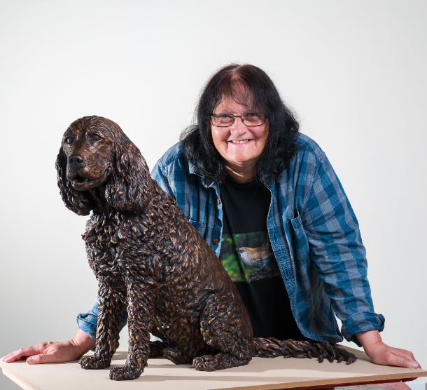 Sculptress Joel and dog statue commission